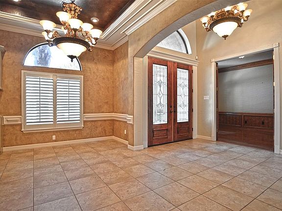 Dining room just off entry with study/office in background