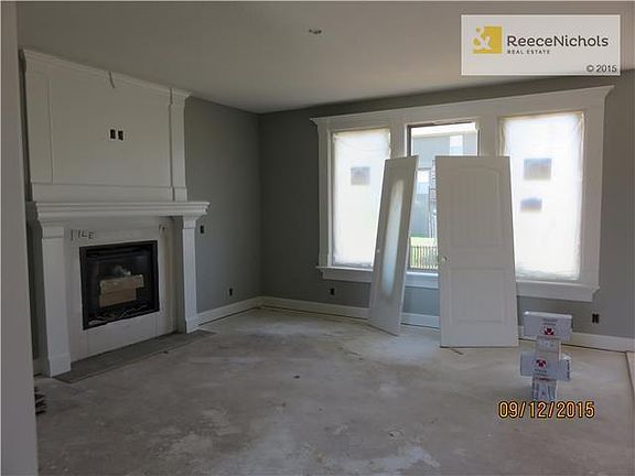 Great room under construction with white trim.