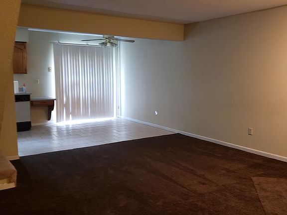 Living room showing eat in kitchen area in kitchen