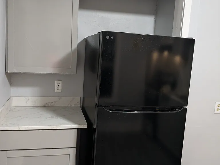 Fridge and coffee/tea counter in recently remodeled kitchen