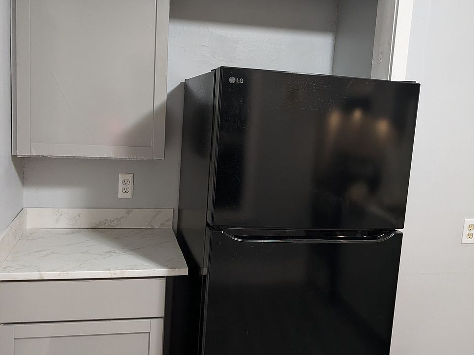 Fridge and coffee/tea counter in recently remodeled kitchen