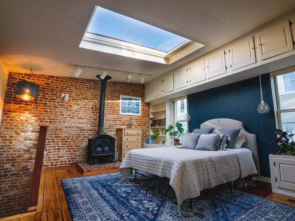 Original brick walls, stove and the most magnificent skylight on Capitol Hill.