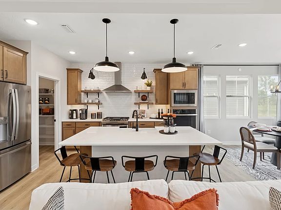 Kitchen with quartz island and countertops