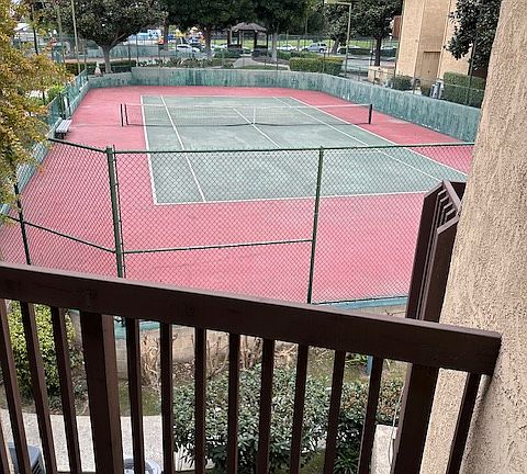 View of tennis court from front balcony