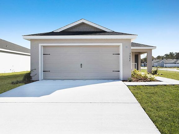 Move-in ready new construction home in Zephyrhills with luxurious finishes, situated on a premium co