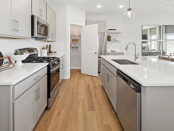 Kitchen with quartz island and countertops