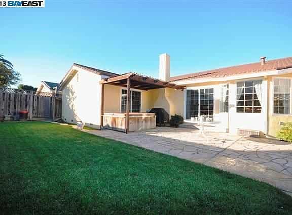 view of our backyard with roofed pergola