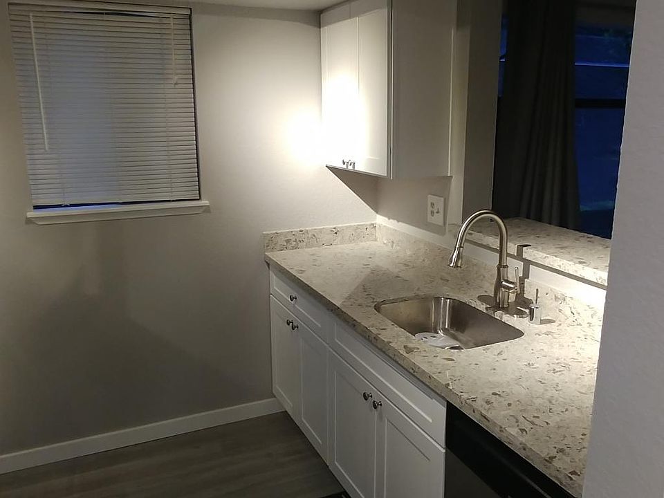 kitchen with undermount sink, granite counter top, white cabinet and dish washer. Garbage disposal under the sink.
