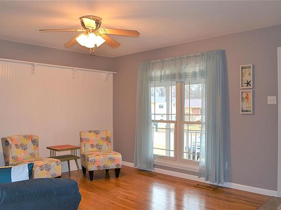 Living Room - Freshly painted and with hardwood flooring!