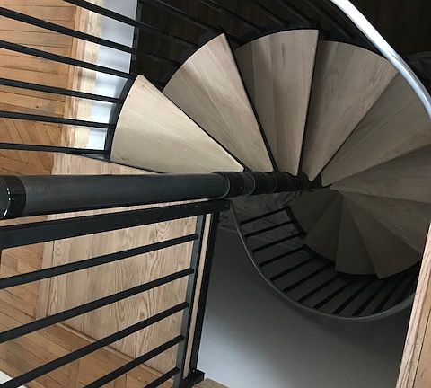 Looking down spiral staircase to lower level