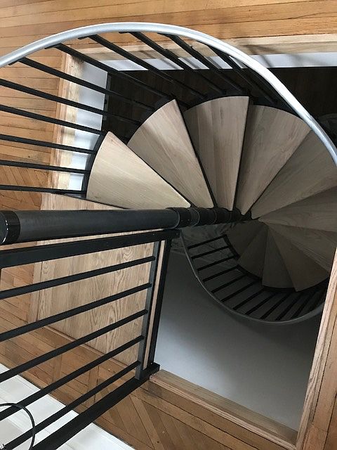 Looking down spiral staircase to lower level