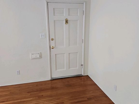 Living room entry door, with Speakeasy, gorgeous floors, new paint