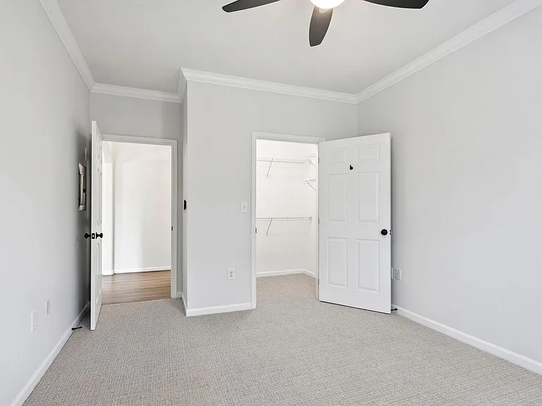 Guest bedroom with walk-in closet access. Newly painted and new carpet.