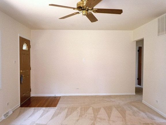 Freshly Painted and Newly Carpeted Home Welcomes You into Lovely Living Room