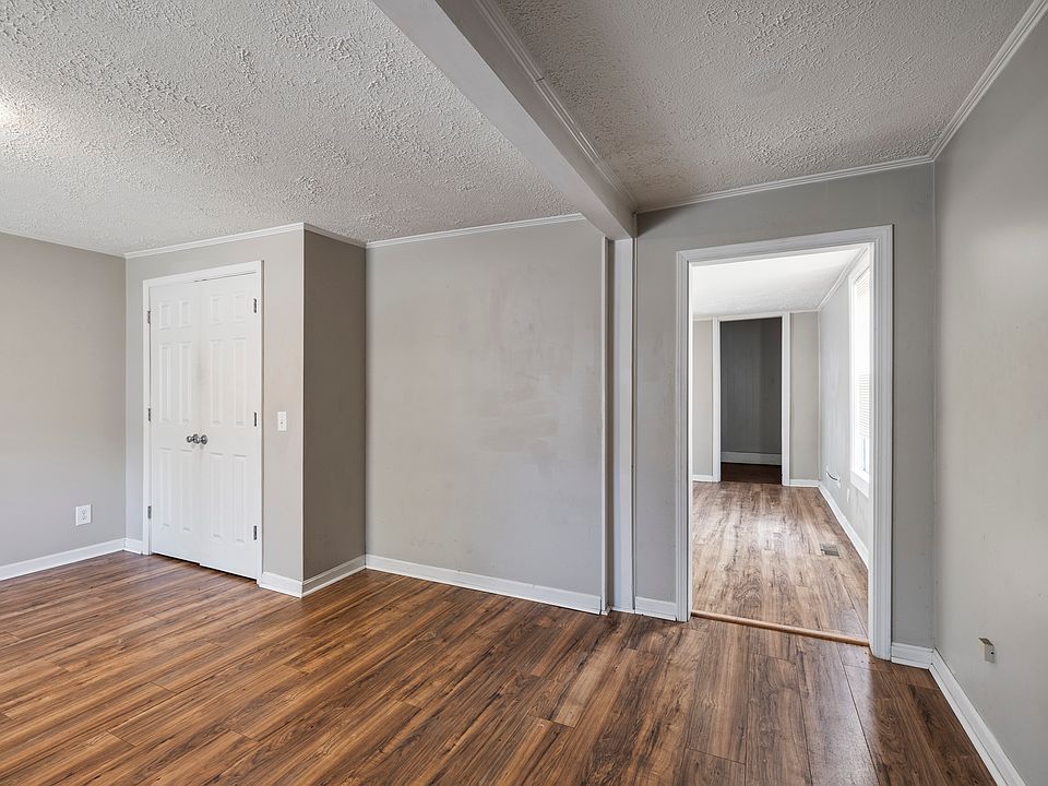 Living room from front door; closet is laundry