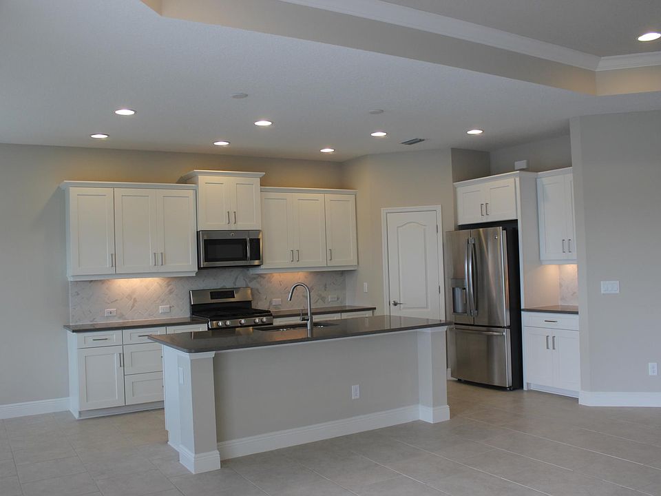 Kitchen with stainless steel appliances and a neutral pallette