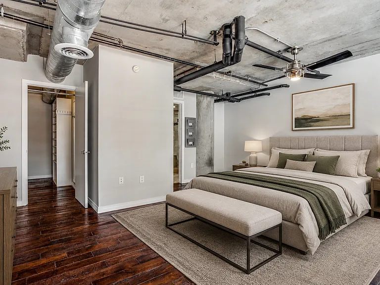 Retreat to the upstairs bedroom, complete with an en-suite bathroom + walk-in closet, offering privacy & convenience in a luxurious setting. Enjoy privacy w/ blackout electric roller shades, or open them up and bask in the light (virtually staged)