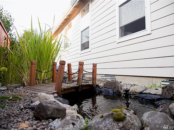 Adorable koi pond + contemplation zone... get away from it all within seconds to read Lilac Girls, Where the Crawdads Sing, or Gilead.