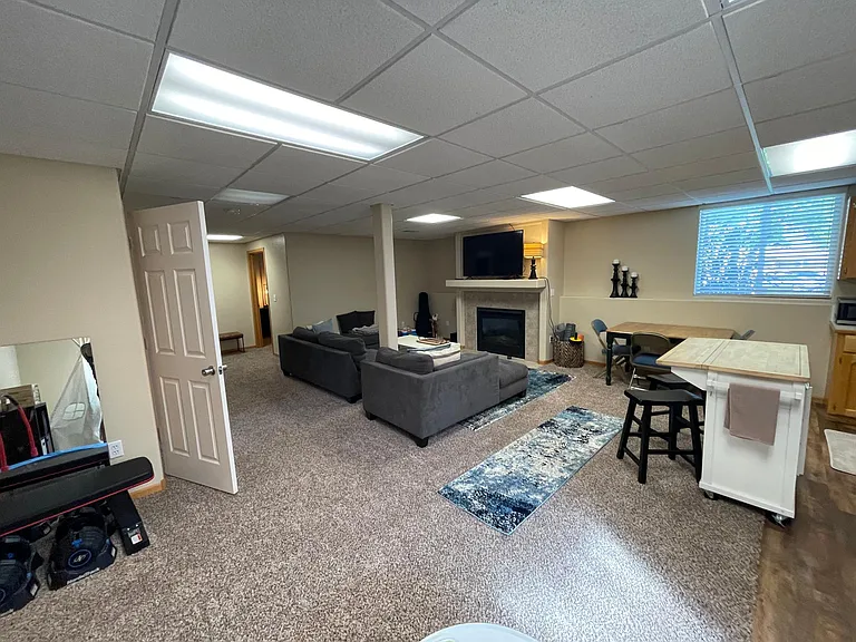 Garden level living room with fireplace