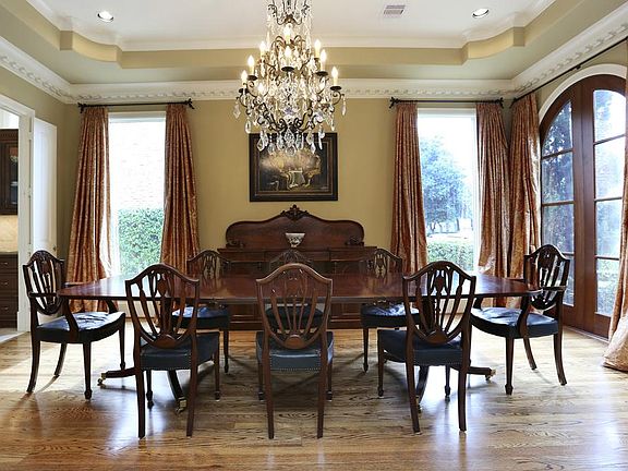Formal dining room with grand proportions and lovely floor to ceiling windows