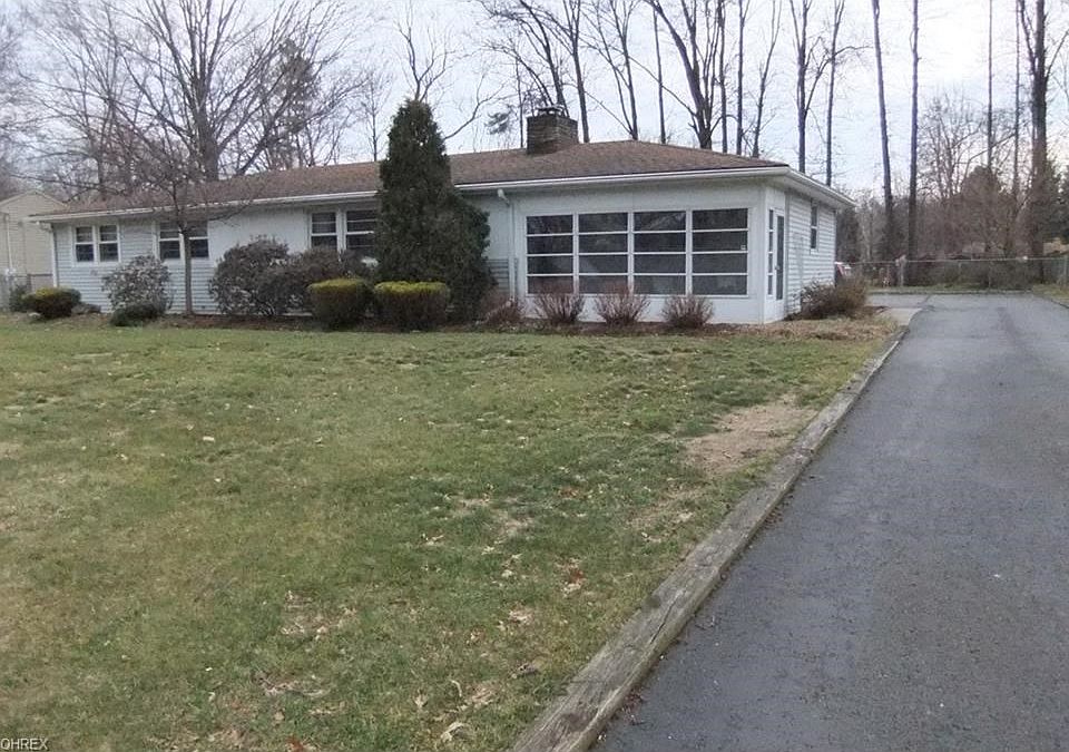Front view 0f 8820 Spring Valley Dr. on 1/2 acre lot.