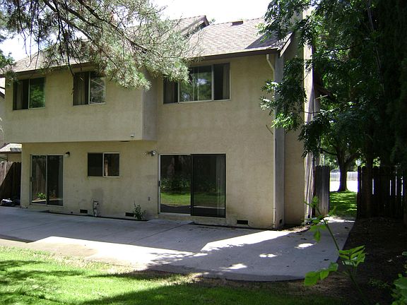 Back yard, large concrete patio, side yard gate, large family room slider door, kitchen window, dinette slider door. Upstairs bedroom windows.