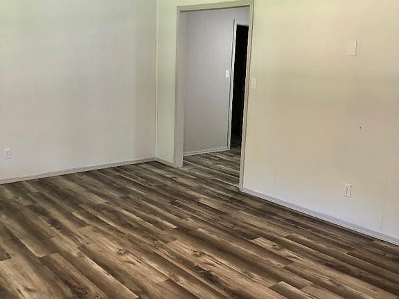 Living room looking toward kitchen/laundry.