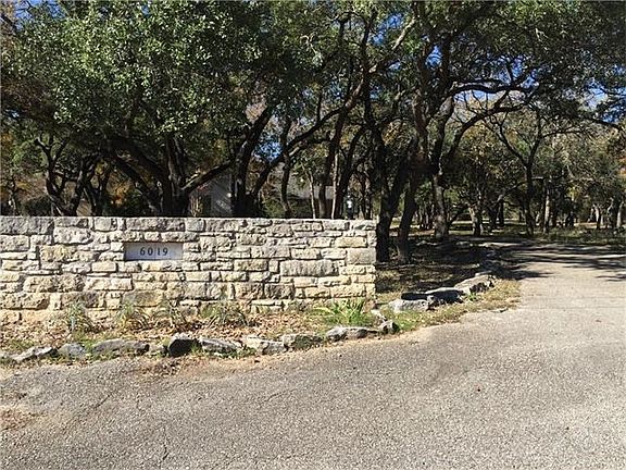 Love the circle driveway and the entrance to this home!