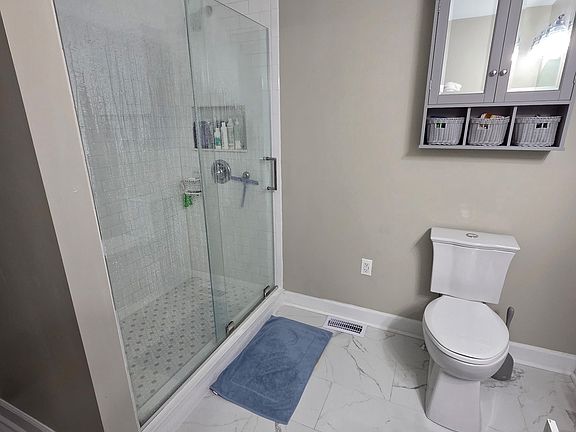 Marble tile and glass shower