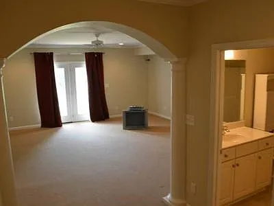 Ground Floor living area with separate entrance can function as 2nd Primary bedroom with full bath, wired for home theatre, and multiple closets. Also includes separate storage/utility room.