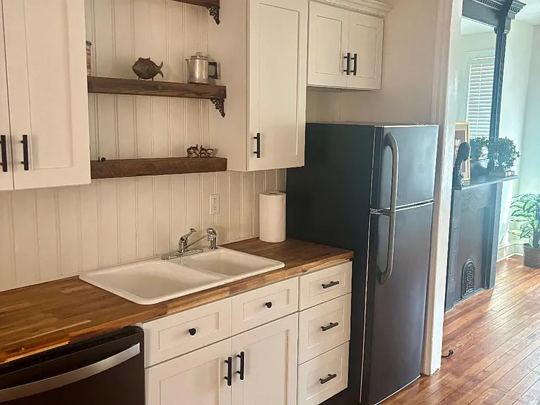 Kitchen with dishwasher, gas stove, garbage disposer and refrigerator