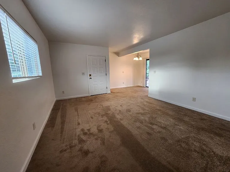 Living room looking south to front door and dining room