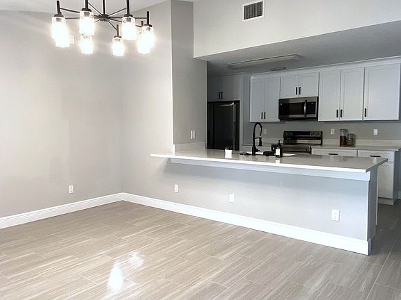 Kitchen with new cabinets, soft closed drawers, quartz counter top, stainless steel appliances