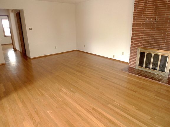 Living room with Brick fireplace