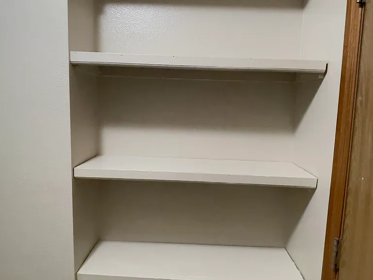 Floor to Ceiling Pantry (or Storage Shelving) behind Laundry Rm. door