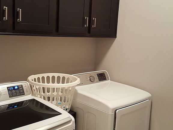 Laundry  with cabinets
