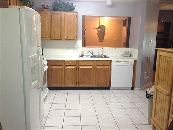 Huge kitchen has an ample counter space for the chief in the family
