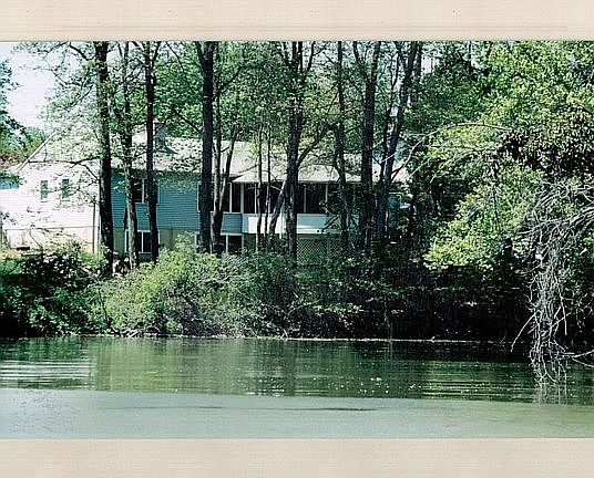 Coming up to the house by boat ( before new siding)