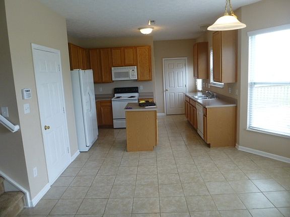 Upgraded Tile Kitchen Floor/Solid Surface Countertops