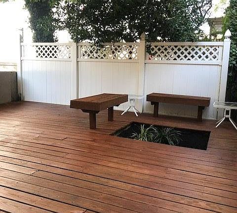 Private decked back yard with built in benches