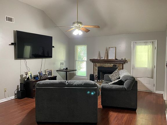 Living Room with vaulted ceiling and fireplace