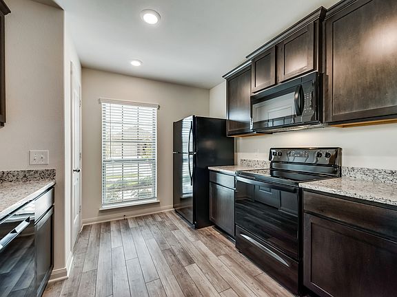 The kitchen comes with a full suite of energy-efficient appliances