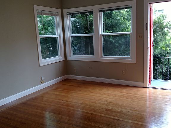 Unit entry. Exterior tree provides shade and privacy in living area.