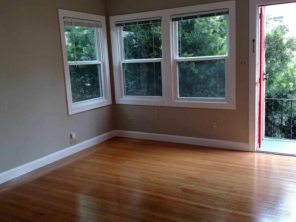 Unit entry. Exterior tree provides shade and privacy in living area.