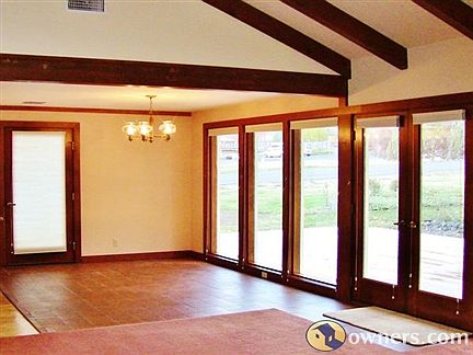 Light and airy dining space looks out on new deck.