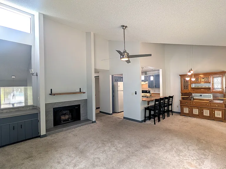 Main living area with vaulted ceilings and natural light.