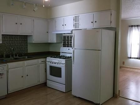 Spacious kitchen with gas stove, dishwasher, ceiling fan, lots of storage!