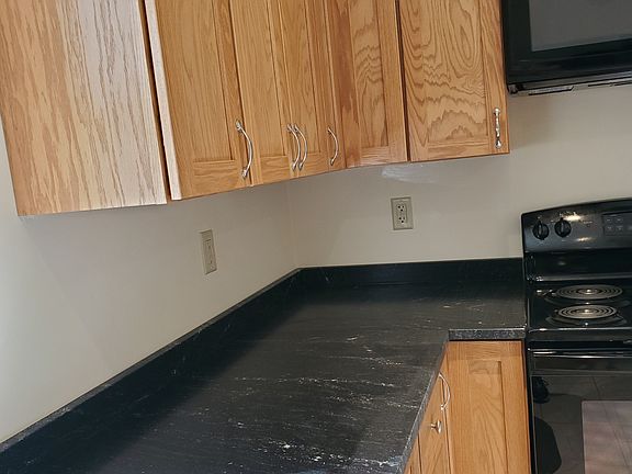 Black leather countertops complete this upgraded kitchen