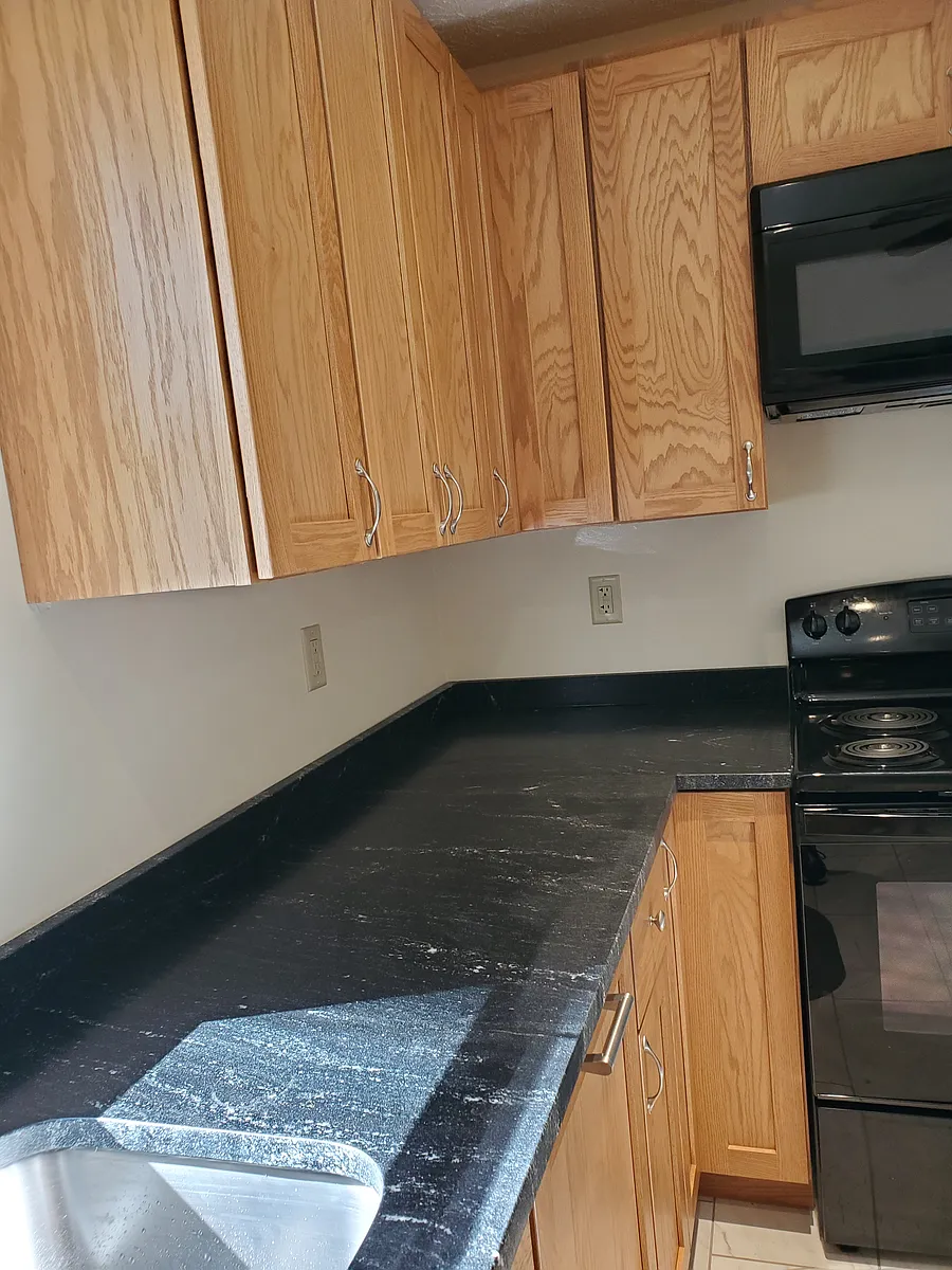 Black leather countertops complete this upgraded kitchen - 301 Chapelfield Rd