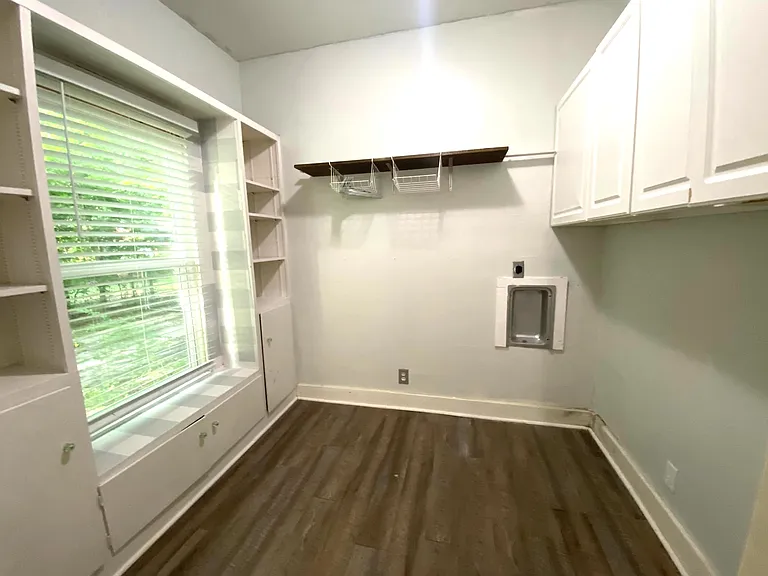 Separate laundry room by the kitchen